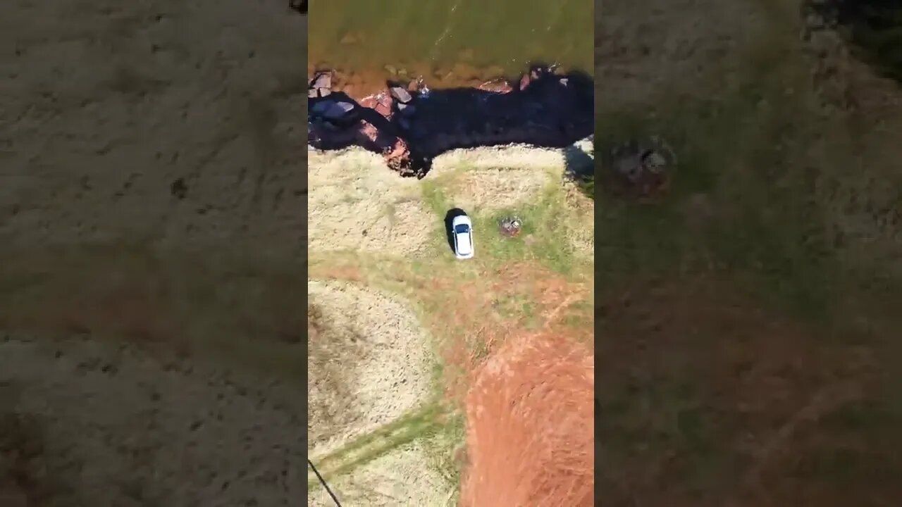 Drone shot of car at beach