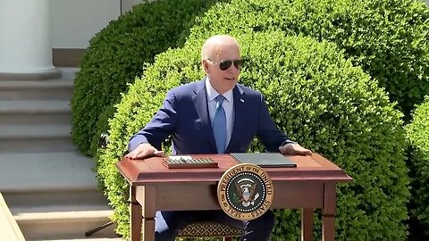 Joe Biden Sits Down At Desk, Immediately Notes "The Desk Is Hot"