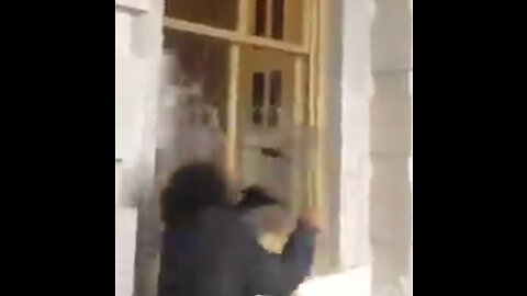 Jan. 6, 2021: Alleged protester using police equipment to destroy window