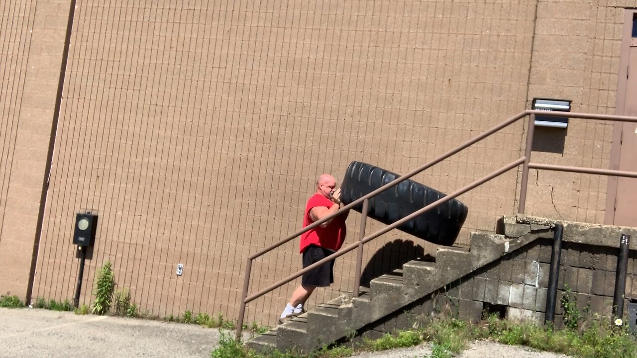 Flipping 200 pound tire upstairs.