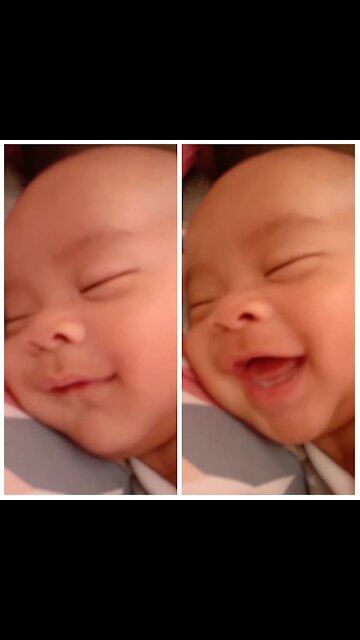 Babies laugh adorable while sleeping.