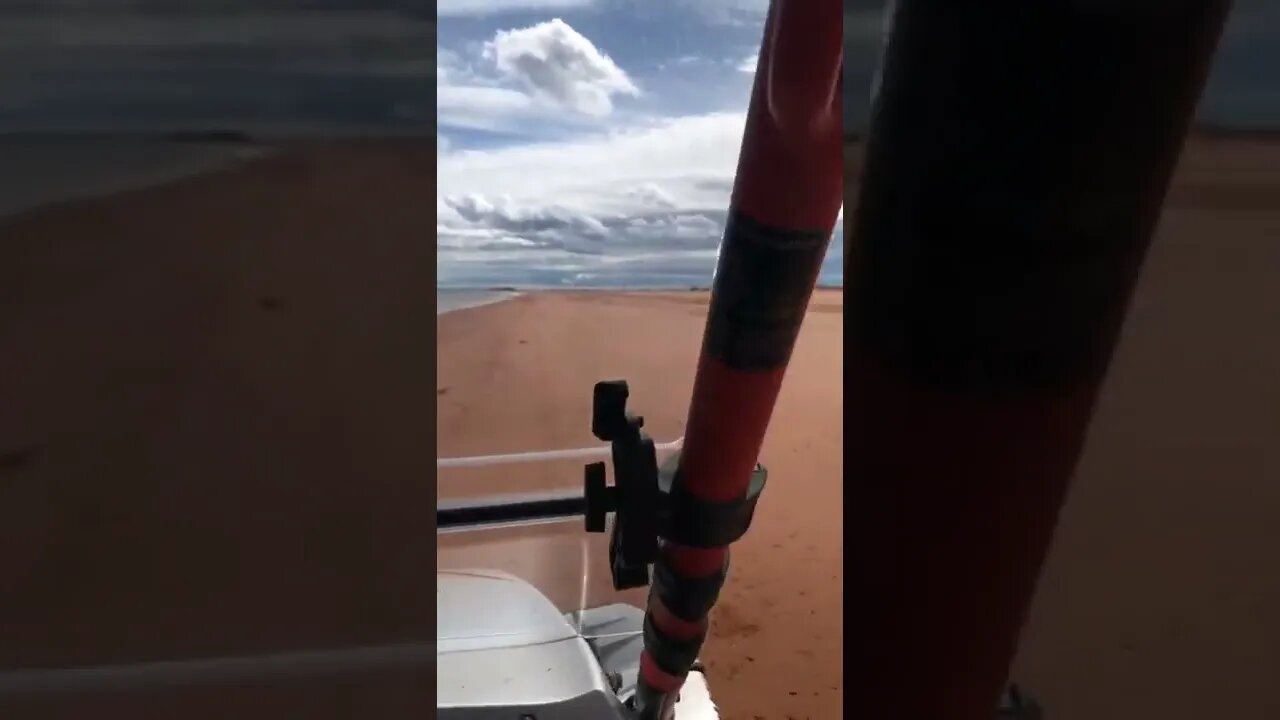 Riding a side by side down a beach
