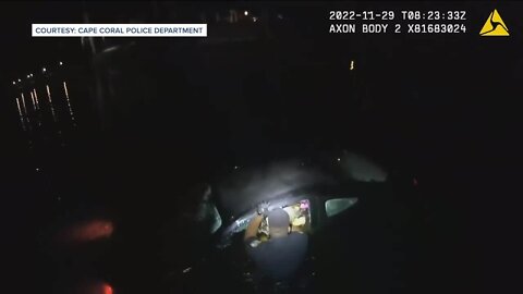 Officer rescues woman from sinking car