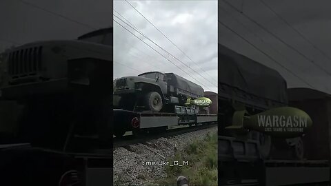 Military train load of Russian trucks & armor