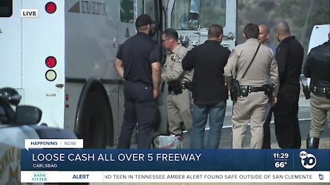 Loose cash leaves I-5 traffic stalled in Carlsbad