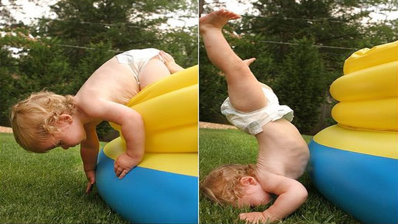 Cute baby playing with a toy dog