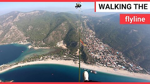 Stunning footage of a slackliner balanced on a slackline tied mid air