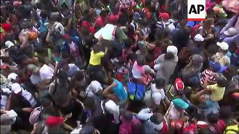 Caravan Hits US-Mexico Border, Members Immediately Start Climbing Fence