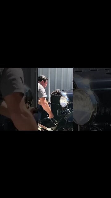 Crank start an antique car BY HAND?