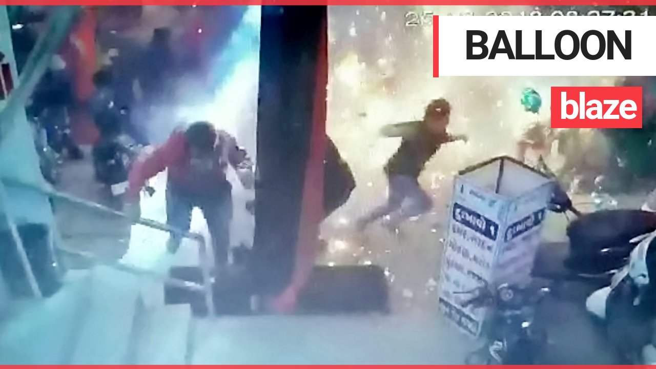 Shocking moment balloon seller causes inferno at Christmas market