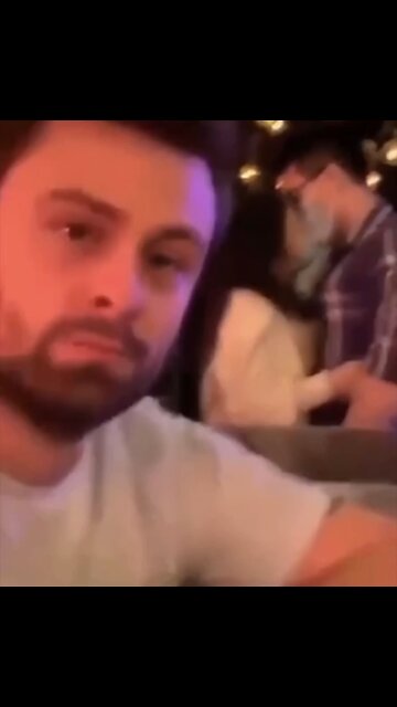 Kissing couple wearing masks!