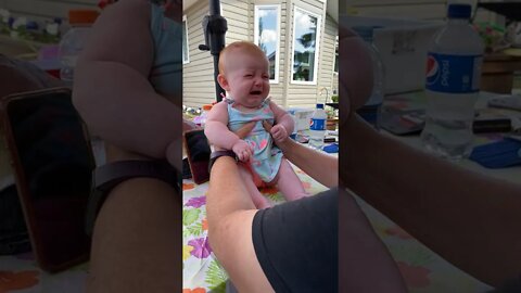 Cute adorable baby child with warm white and pink hat with cute baby girl