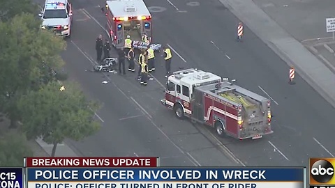 Man in serious condition after crashing into police car in Phoenix