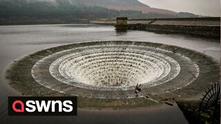 Stunning footage shows spillway in full flow after Britain was battered by heavy rainfall