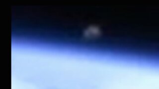 ISS Camera Captures UFO above Earth