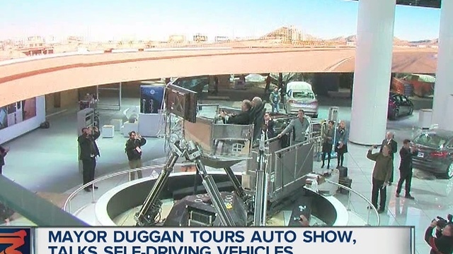 Mayor Duggan gets tour of auto show