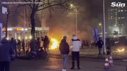 Riots erupt in The Hague with protesters torching cars and clashing with cops