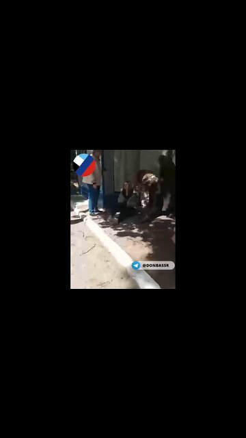 An ambulance picks up the wounded during the shelling of the Textile Worker neighborhood in Donetsk