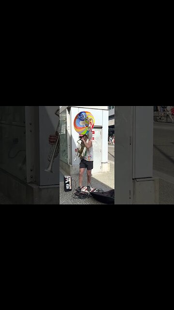 Busker playing the Tuba and beat boxing downtown Vancouver