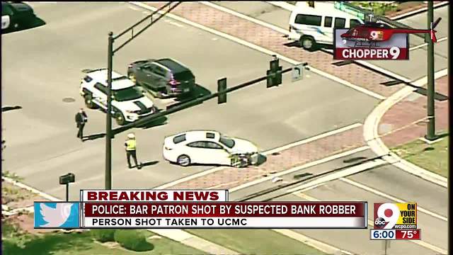 Police: Bar patron shot by bank robbery suspect