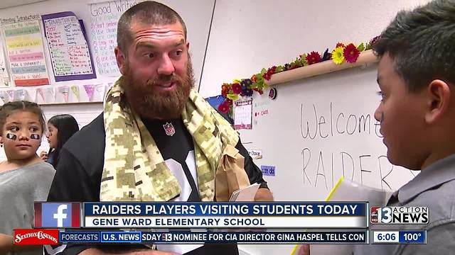 Raiders visit Gene Ward Elementary to congratulate art contest winner