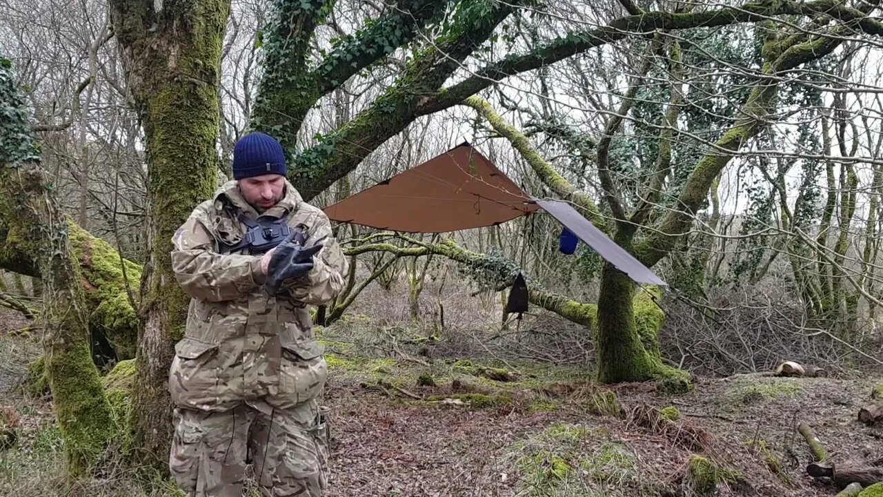 Let's start taking down the DD hammocks 3x3 tarp. Reddacleave campsite. Dartmoor 26th March 2023