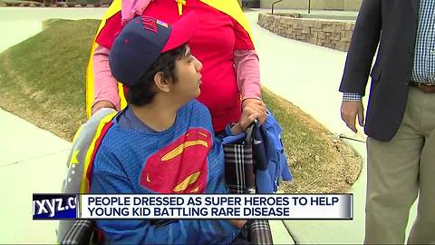 People dressed as super heroes to help metro Detroit kid battling rare disease