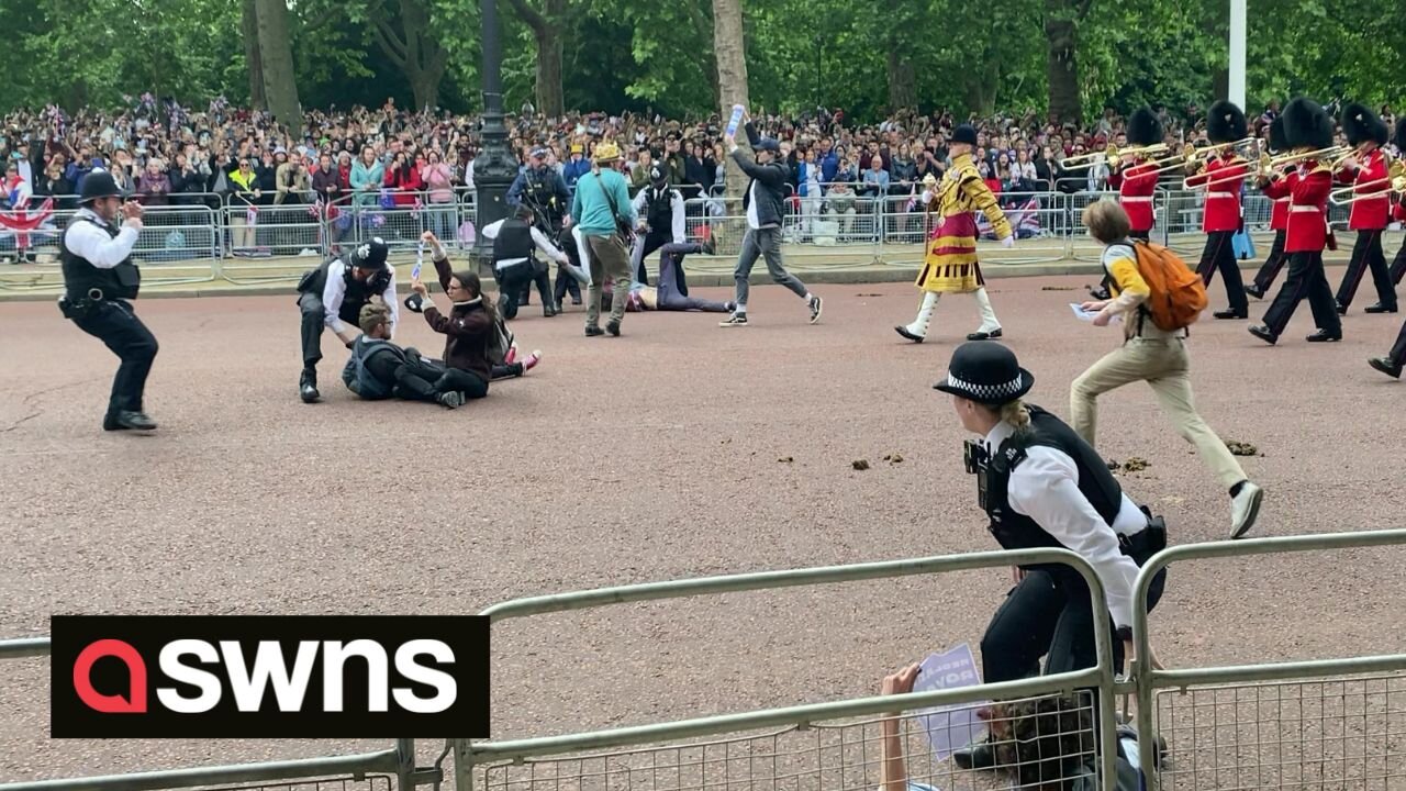 Queen’s jubilee parade shows protesters storming onto the mall before being dragged away by police