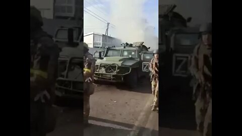 Ukraine soldier looks at army vehicles and says " liberate us from this tyranny!"