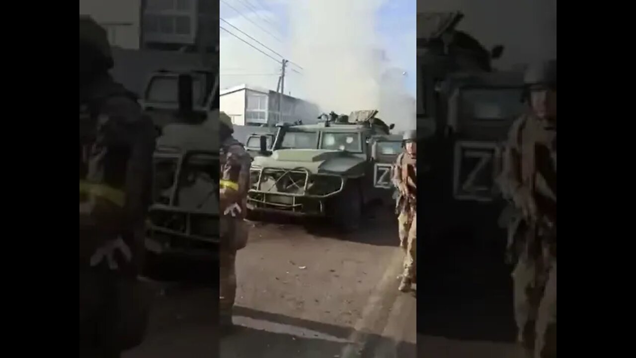 Ukraine soldier looks at army vehicles and says " liberate us from this tyranny!"
