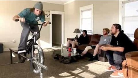 Guy shows off BMX skills in house during quarantine