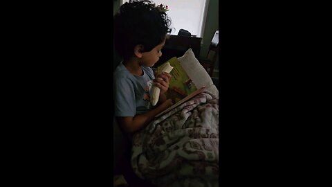 Noah reads about Little Blue Truck.
