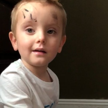 Little Boy Puts On His Mom's Makeup Before His Playdate