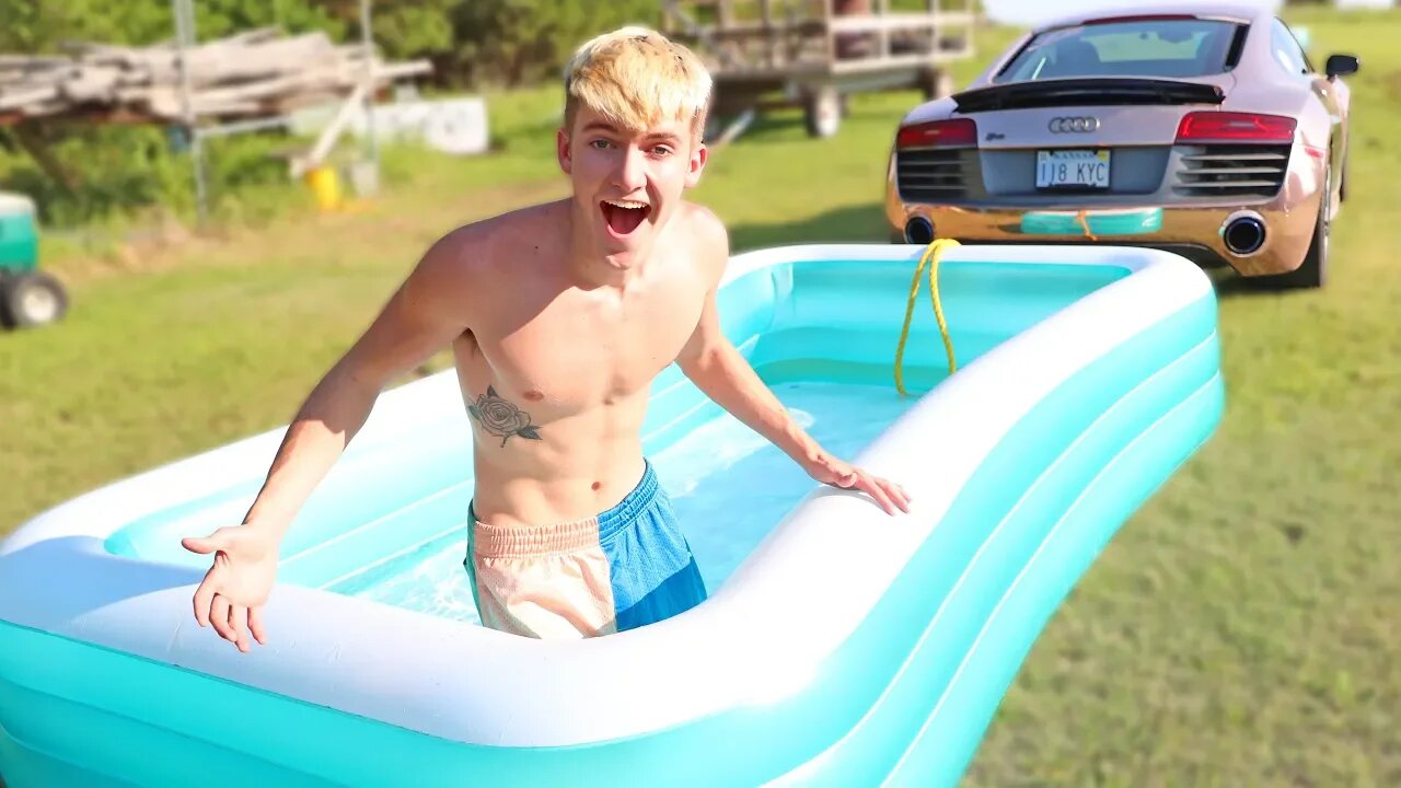 WE TRIED SLEDDING IN A POOL BEHIND MY SUPERCAR!