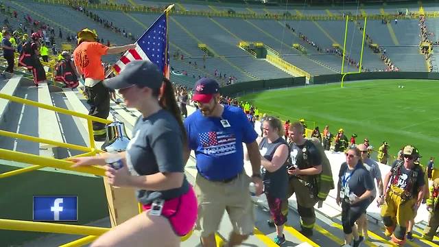 Climbers honor 9/11 first responders by walking Lambeau's steps