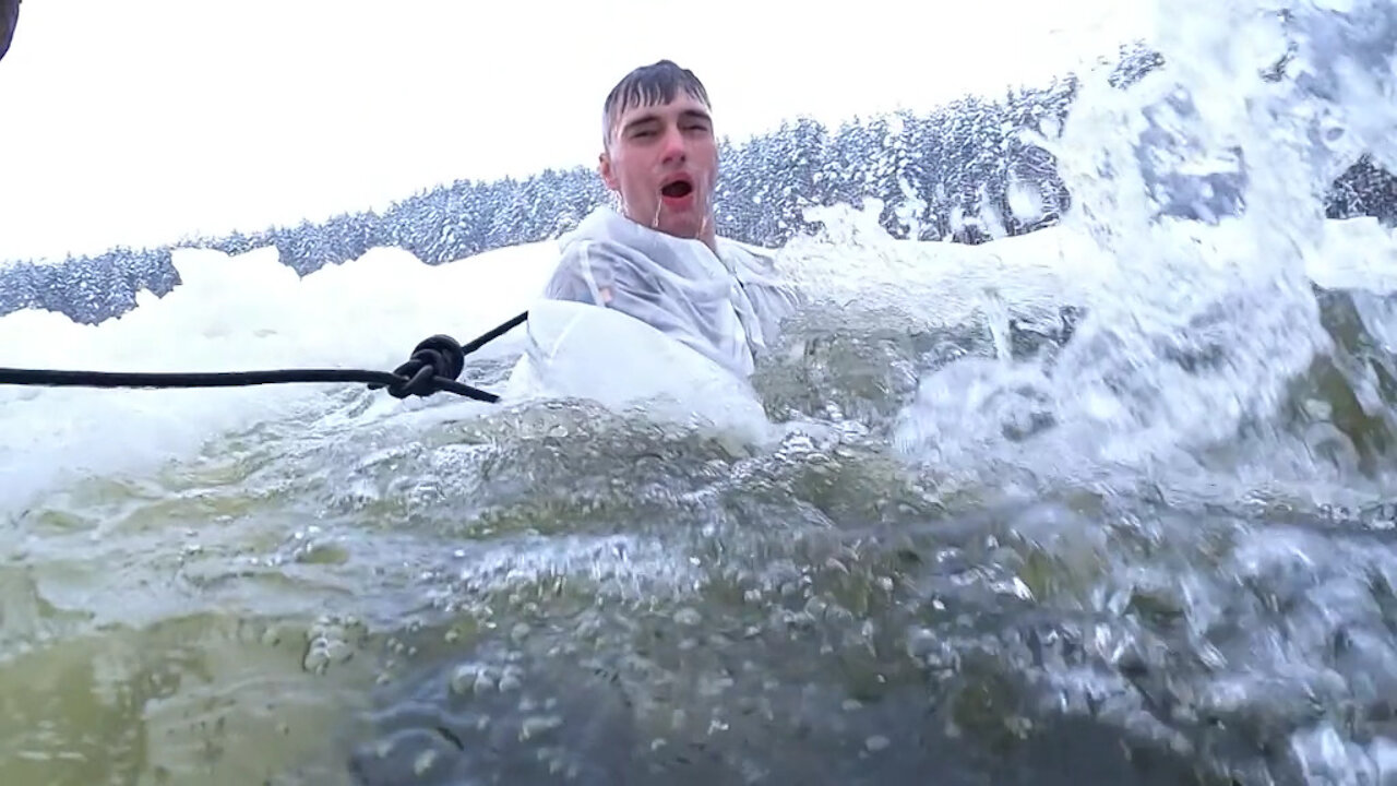 UK troops take the plunge into icy water in freezing conditions