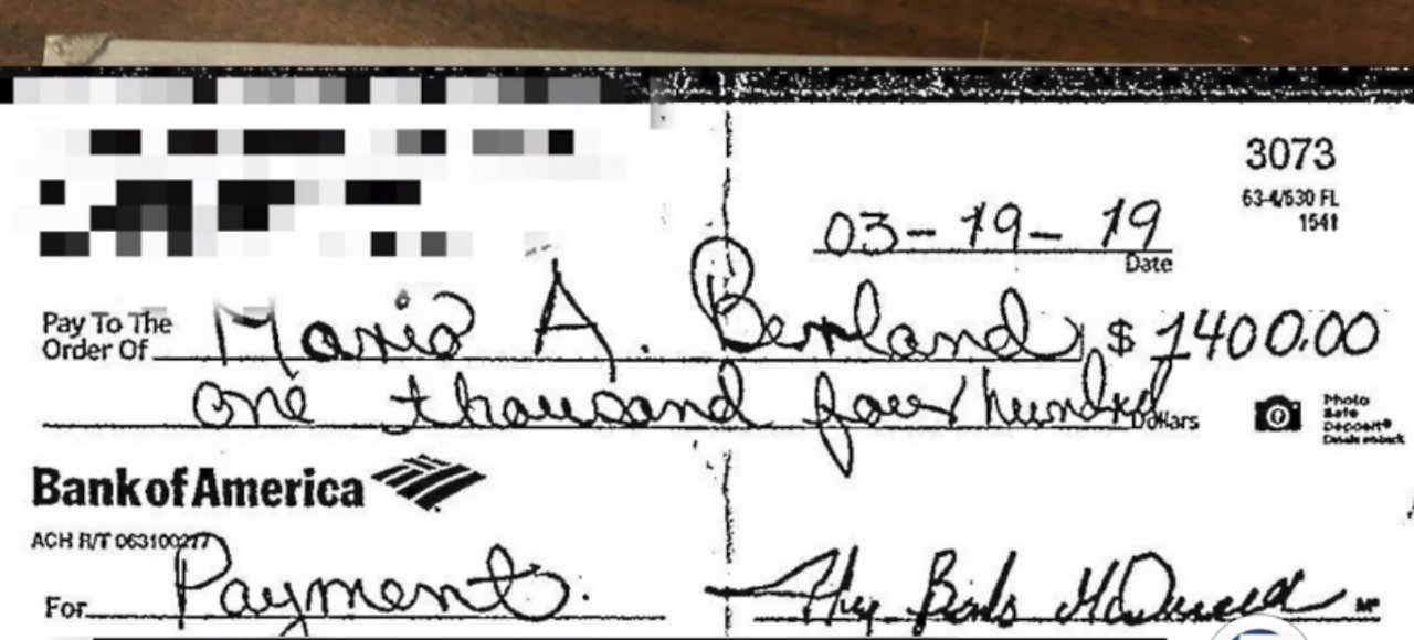 Woman's check 'washed, changed from $132 to $1400