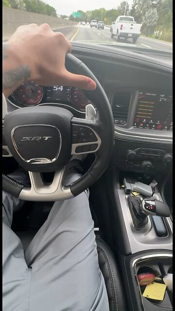 Sneako driving his hellcat