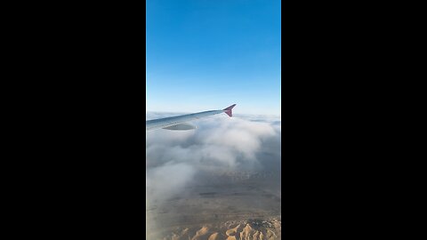 Plain cut the desert clouds