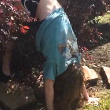 A Girl Backflips Into A Bush And Gets Stuck