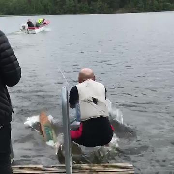 A Senior Man Goes Water Skiing