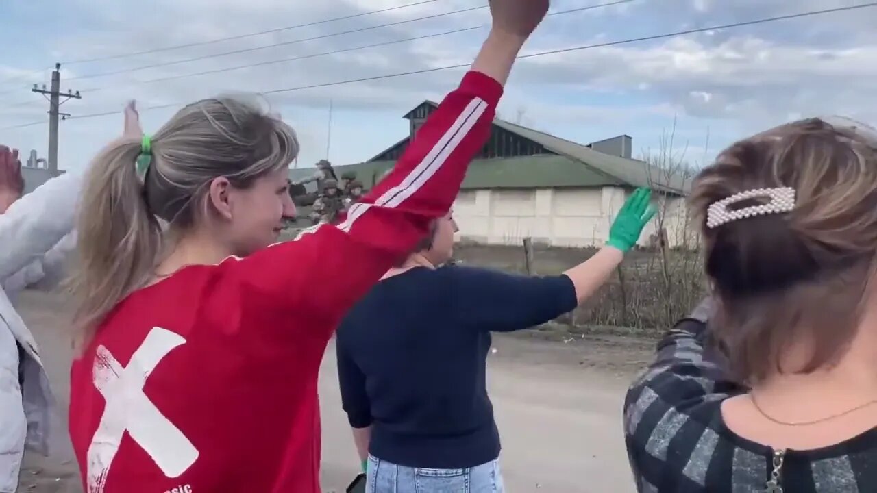 People greeting a Russian column somewhere in the Kharkov region