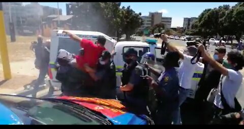 Police fire stun grenades and arrest tow Saftu members in Cape Town