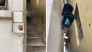 Tiny one-way stairway in Prague requires traffic light for pedestrians