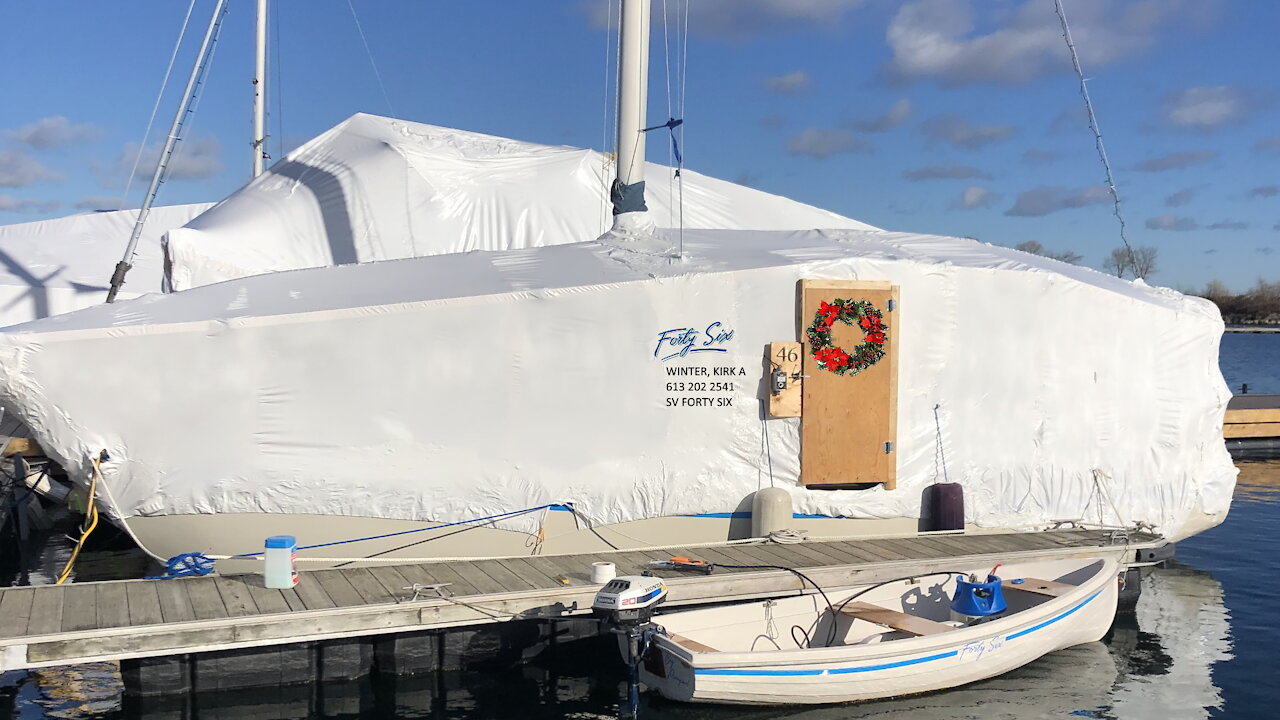 Installing the plastic dome over my sailboat home for winter