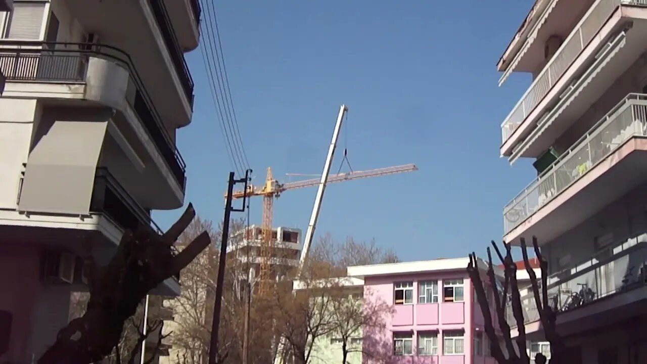 Crane dismantling without accident and compilation next to a school