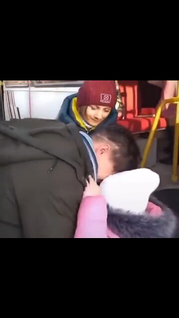 Ukrainian father says "goodbye" to his family before they board a bus headed to a "Safe Zone."