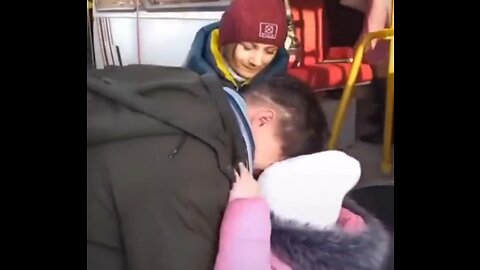 Ukrainian father says "goodbye" to his family before they board a bus headed to a "Safe Zone."