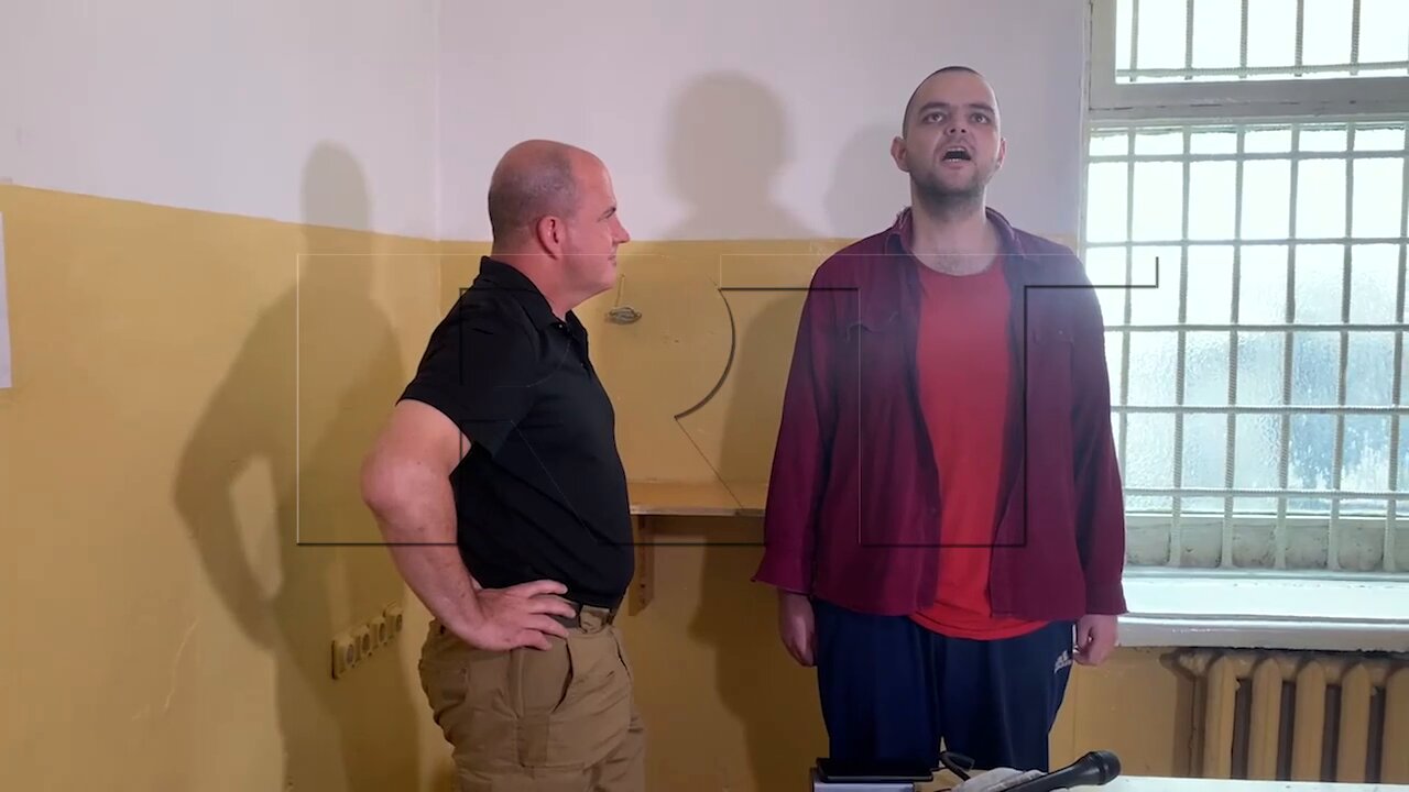 Aiden Aslin sings the Russian anthem while awaiting appeal of his death sentence in DPR