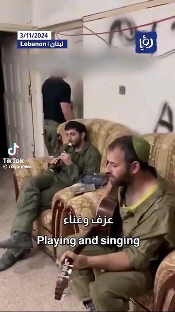 Israeli soldiers play & sing in a house in Lebanon after occupying it.